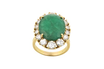 Lot 2231 - An Emerald and Diamond Cluster Ring the oval...