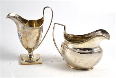 Lot 198 - Georgian silver helmet cream jug and another, Sheffield 1807, maker's mark TW