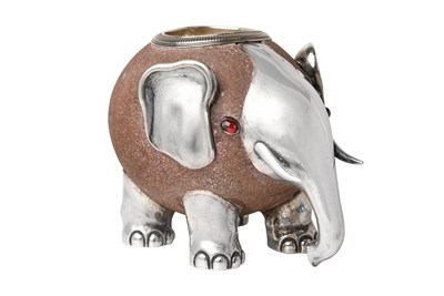 Lot 2078 - A Russian Gem-Set Silver-Mounted Sandstone Match-Holder in the Form of an Elephant