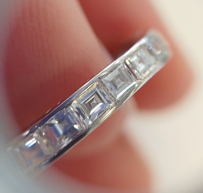 Lot 2300 - A Diamond Eternity Ring twenty square cut...