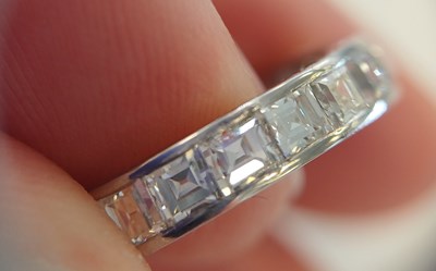Lot 2300 - A Diamond Eternity Ring twenty square cut...