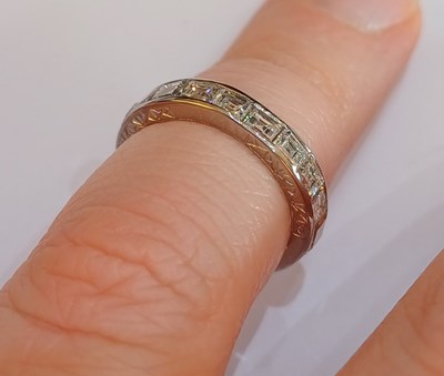 Lot 2300 - A Diamond Eternity Ring twenty square cut...