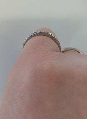 Lot 2300 - A Diamond Eternity Ring twenty square cut...