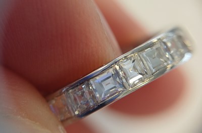 Lot 2300 - A Diamond Eternity Ring twenty square cut...