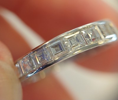 Lot 2300 - A Diamond Eternity Ring twenty square cut...
