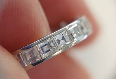 Lot 2300 - A Diamond Eternity Ring twenty square cut...