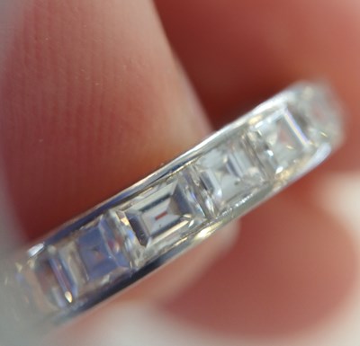 Lot 2300 - A Diamond Eternity Ring twenty square cut...