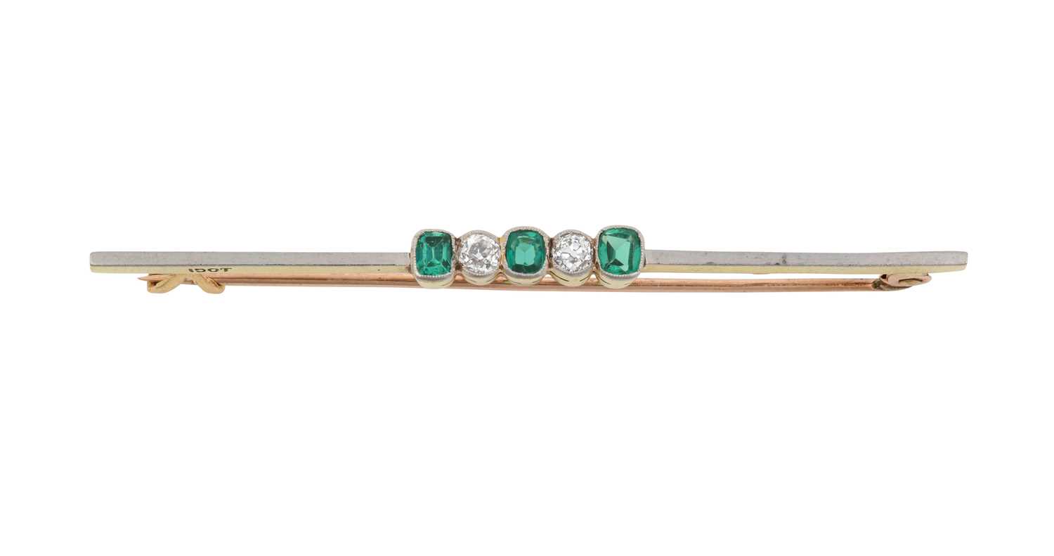Lot 2101 - A Green Stone and Diamond Brooch three cushion...