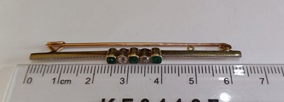 Lot 2101 - A Green Stone and Diamond Brooch three cushion...