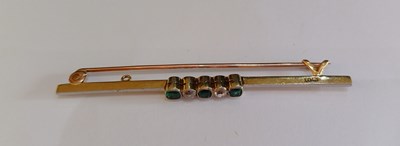 Lot 2101 - A Green Stone and Diamond Brooch three cushion...