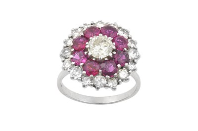 Lot 2200 - A Ruby and Diamond Cluster Ring the central...