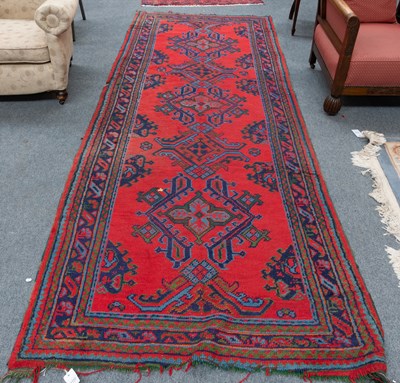 Lot 1112 - Ushak Rug, the tomato red field centred by...