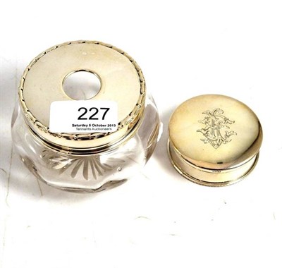 Lot 227 - A glass hair tidy with silver cover and another silver toilet trinket box (missing liner)