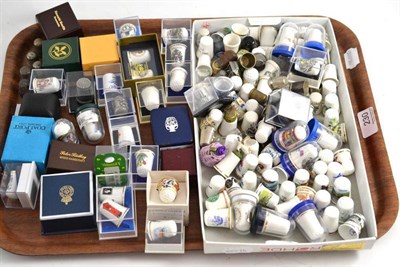 Lot 230 - Five silver thimbles and a collection of plated, pewter and china thimbles