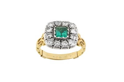 Lot 2283 - An Emerald and Diamond Cluster Ring the square...