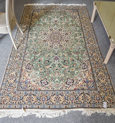 Lot 1215 - Nain Rug, the mint green field of scrolling...