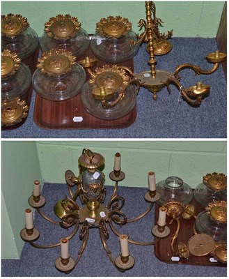 Lot 245 - A gilt metal five-branch chandelier, height 48cm, with glass shades and a pair of matching wall...