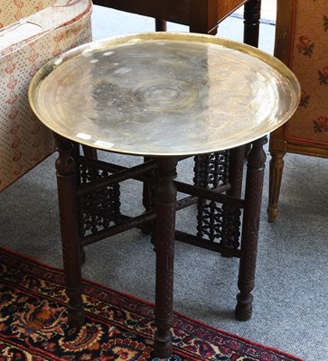 Lot 1182 - A Benares Brass Tray Top Table, on a folding...