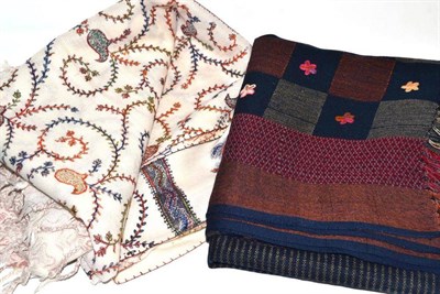 Lot 294 - Two crewel work embroidered wool shawls, on a navy and cream ground