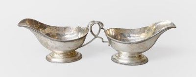 Lot 145 - An Edward VII and a George V Silver Sauceboat,...