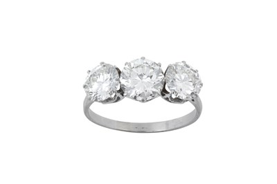 Lot 2081 - A Diamond Three Stone Ring the graduated round...