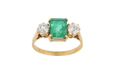 Lot 2057 - An Emerald and Diamond Three Stone Ring the...