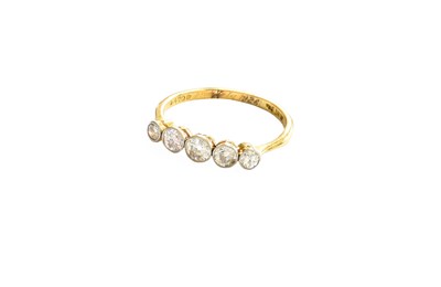 Lot 446 - A Diamond Five Stone Ring, the graduated round...