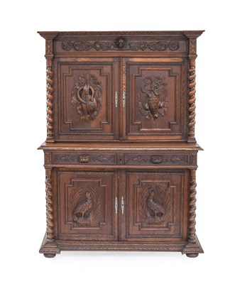 Lot 1236 - A Continental Carved Oak Cupboard, the four...