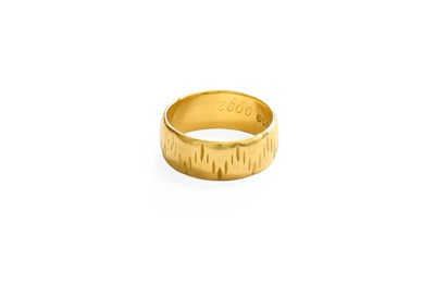 Lot 399 - An 18 Carat Gold Textured Band Ring, finger...