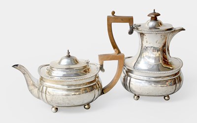 Lot 134 - A George V Silver Teapot and Hot-Water Jug, by...