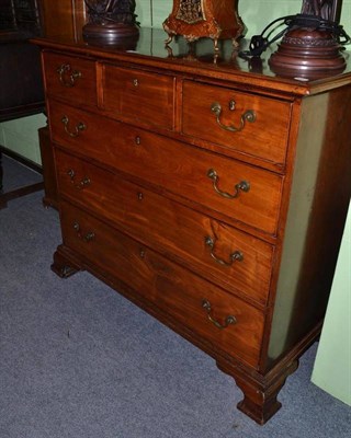 Lot 401 - George III mahogany chest of drawers with brass handles