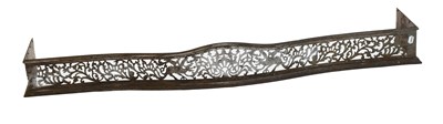 Lot 1271 - A George III Pierced Steel Fender, decorated...