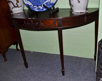 Lot 410 - A Edwardian mahogany demi lune side table