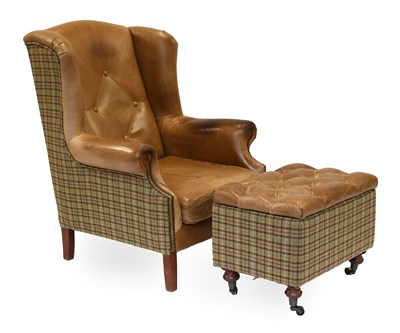 Lot 1138 - A Buttoned Brown Leather and Tweed Wing Chair,...