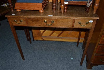 Lot 429 - An oak side table with three drawers