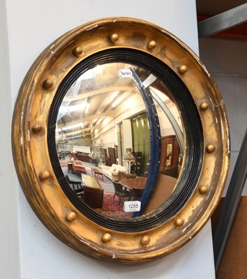 Lot 1255 - A Regency Gilt Framed Convex Mirror, with...