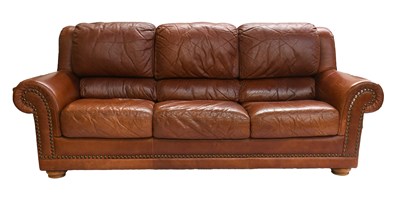 Lot 1273 - A Modern Leather Three-Seater Sofa, with brass...