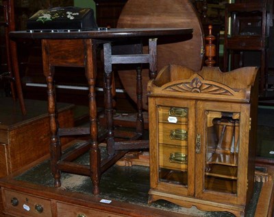 Lot 442 - A small oak dropleaf table, a Japanned wall tidy, a smoker's cabinet and a barometer (4)