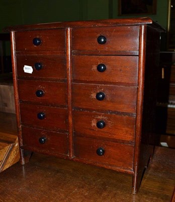 Lot 444 - A ten drawer mahogany miniature chest