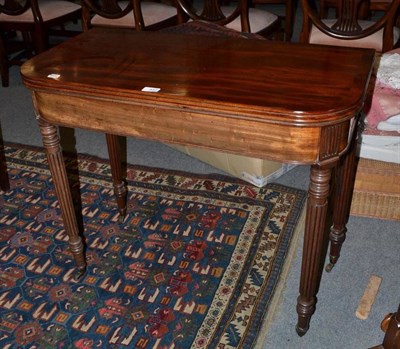 Lot 451 - A 19th century mahogany fold-over tea table