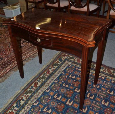 Lot 452 - A mahogany and boxwood strung serpentine shaped tea table, 18th century and later, the moulded...