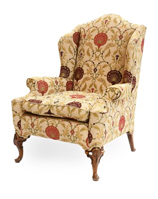 Lot 1296 - A Georgian Style Wing Chair, with floral...