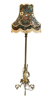 Lot 1268 - A Brass Standard Lamp, on lion mask and scroll...