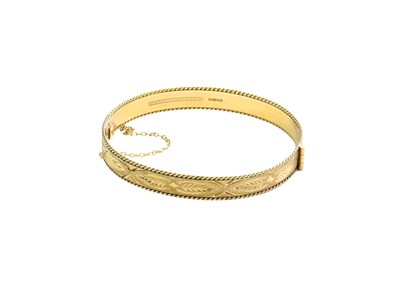 Lot 392 - A 9 Carat Gold Hinged Bangle, of textured and...