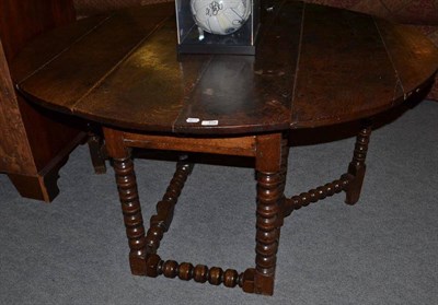 Lot 459 - An 18th century bobbin turned table