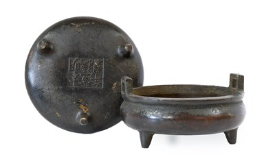 Lot 179 - A Matched Pair of Chinese Bronze Tripod...