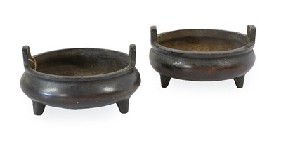 Lot 179 - A Matched Pair of Chinese Bronze Tripod...