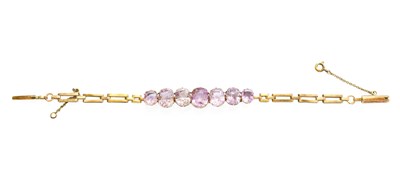 Lot 427 - An Amethyst Bracelet, seven graduated cushion...