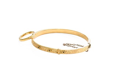 Lot 381 - A 9 Carat Gold Hinged Bangle, inner...