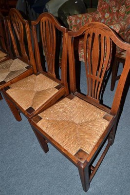 Lot 471 - Harlequin set of seven rush seated chairs